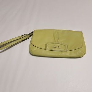 Coach wristlet with magnetic closure